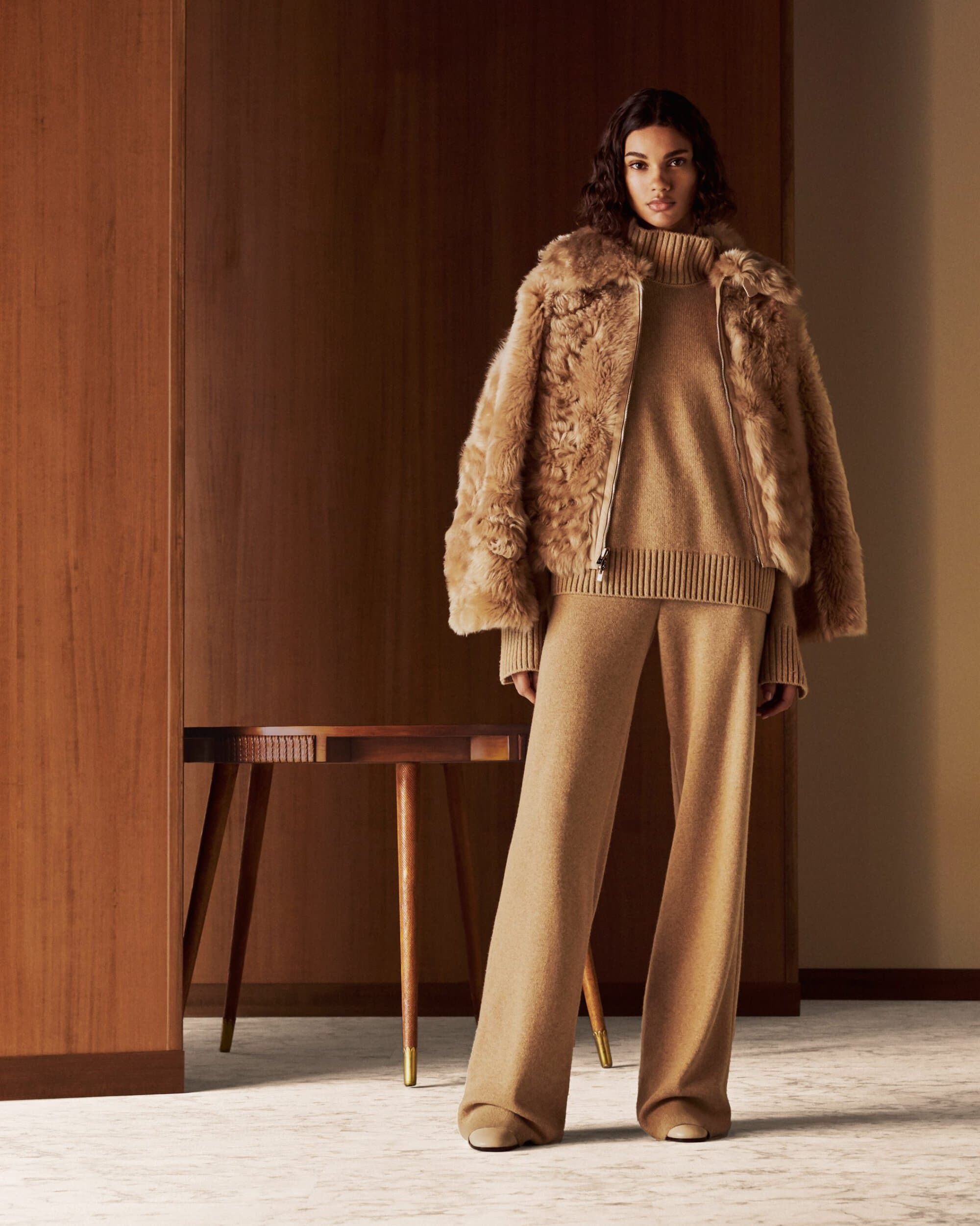 Woman in brown fur coat with knit co-ord set