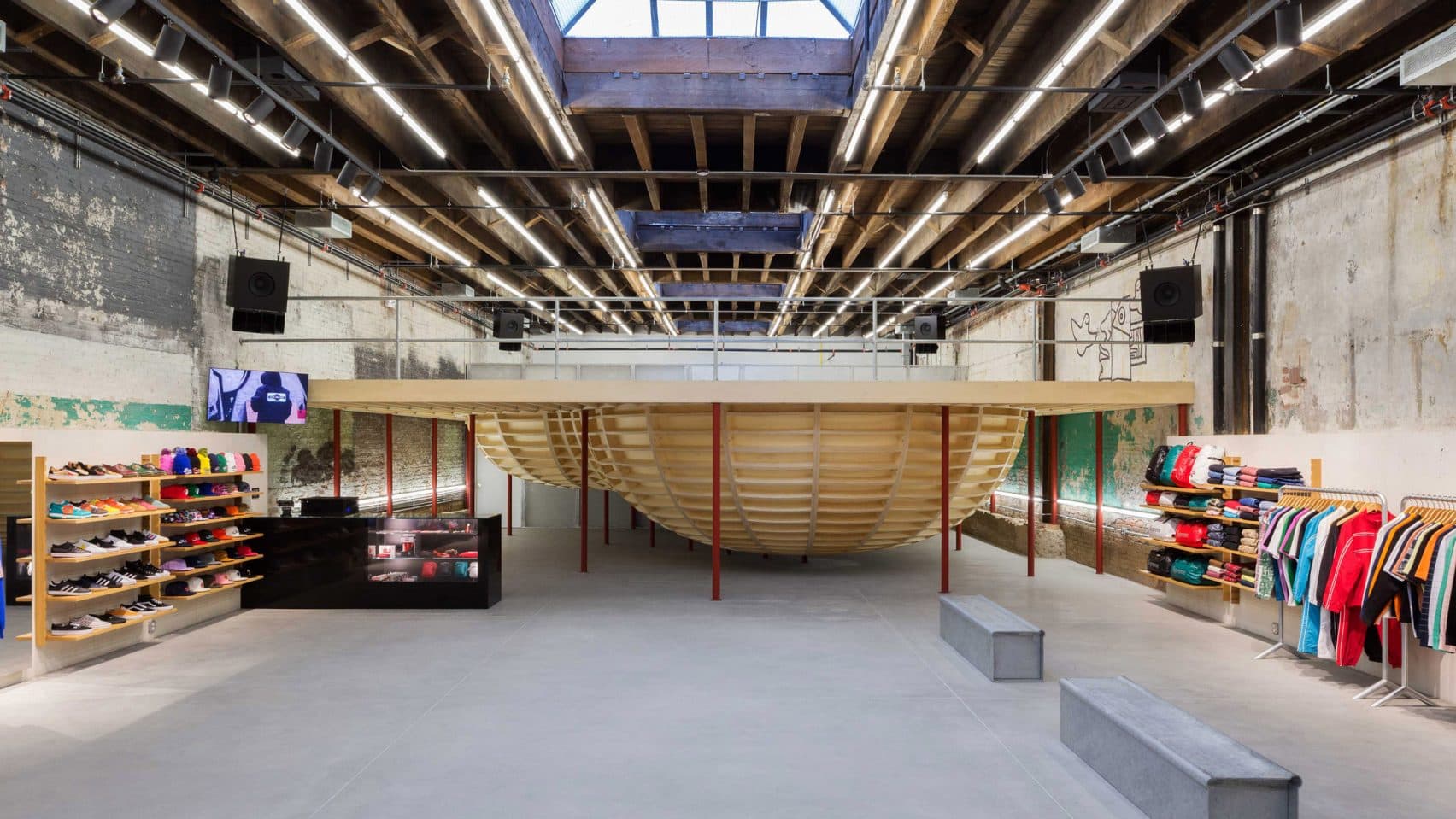 Supreme store in Williamsburg, Brooklyn by architect Neil Logan, featuring an elevated skate bowl