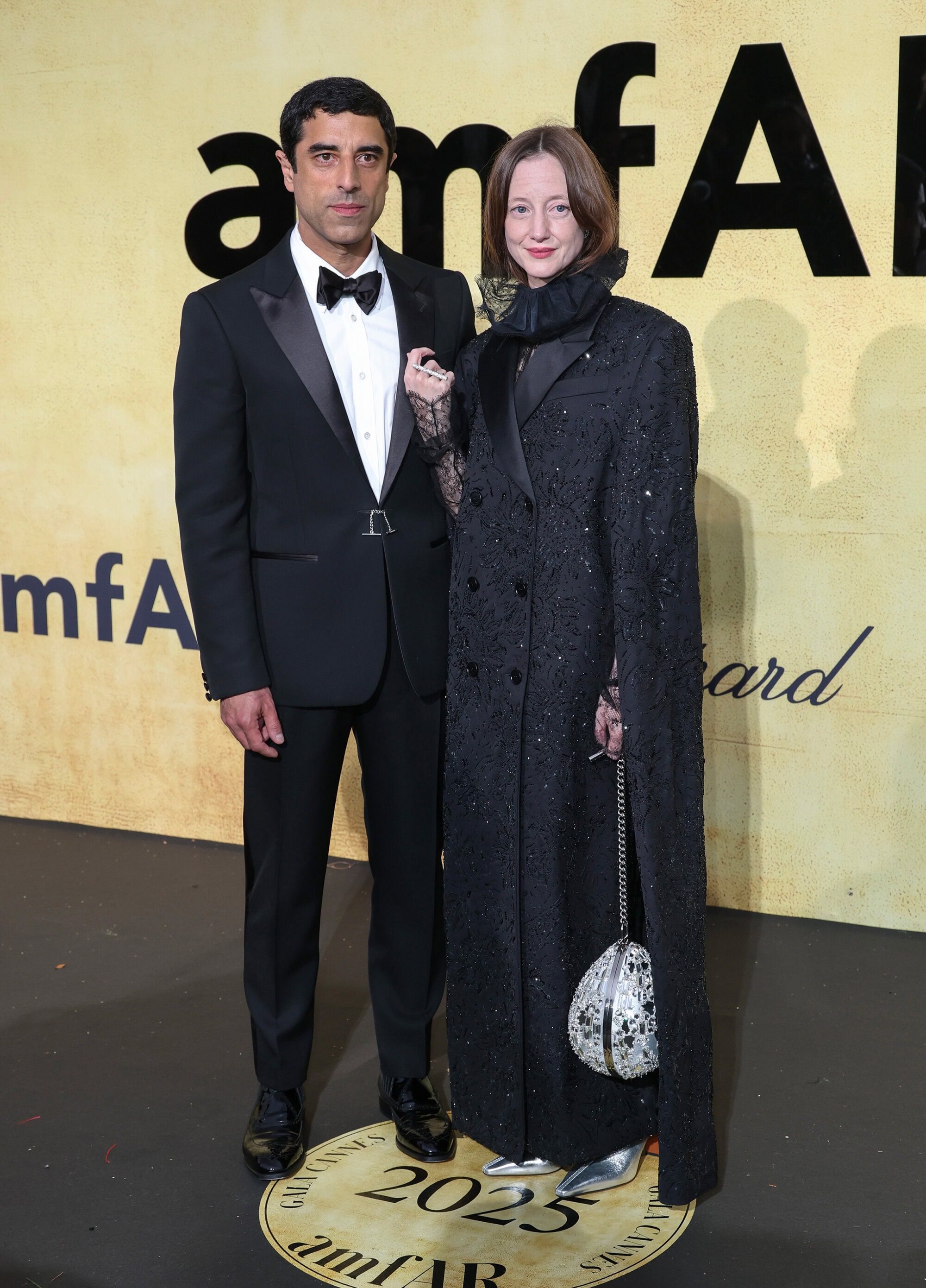 Andrea Riseborough & Karim Saleh in McQueen at the amfAR Gala in Cannes