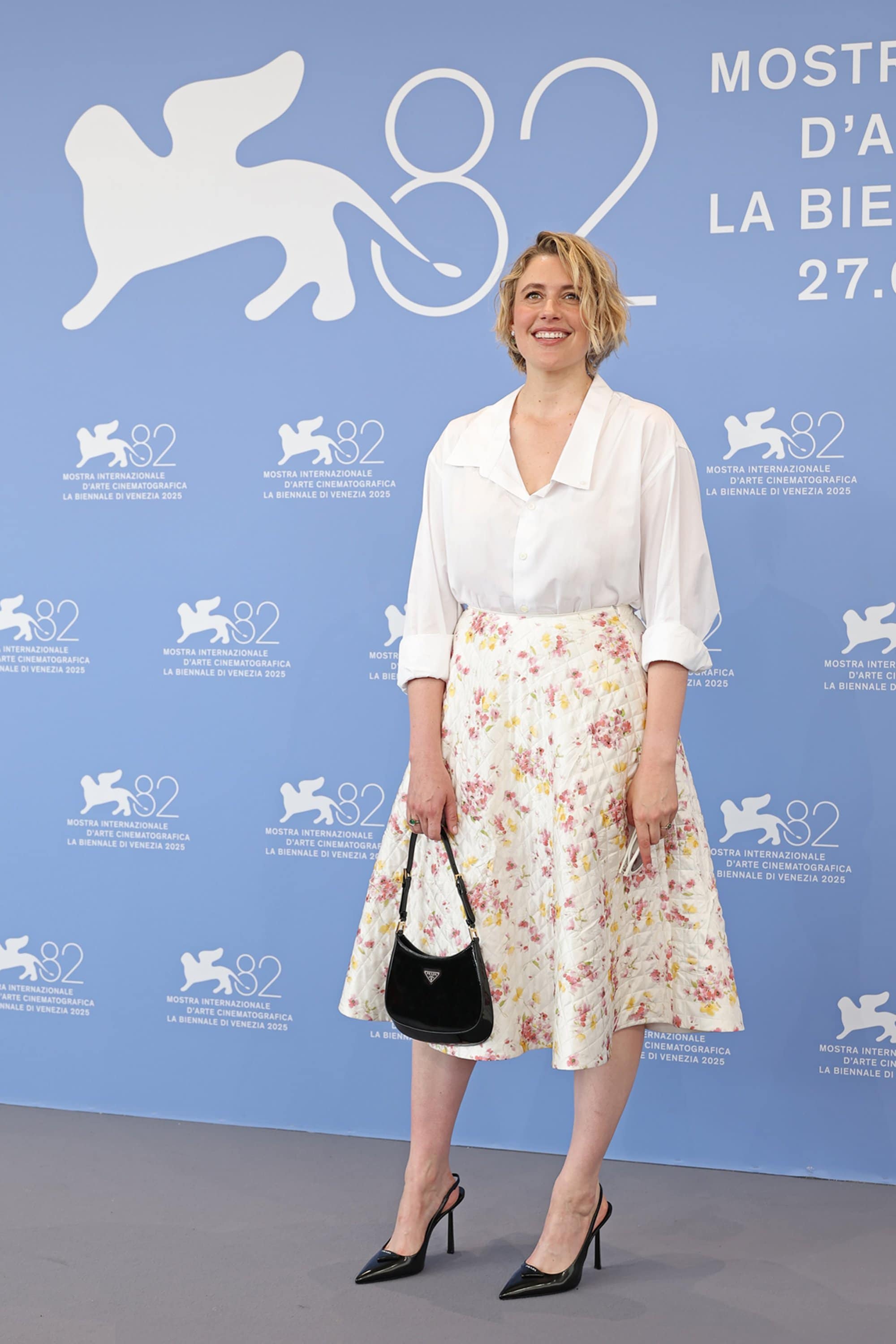 Greta Gerwig in Prada at the "Jay Kelly" photocall during the 82nd Venice Film Festival