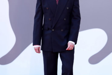 Tom Sturridge in Saint Laurent by Anthony Vaccarello at the “The Wizard of Kremlin” red carpet at 82nd Venice Film Festival