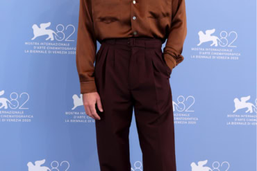 Lewis Pullman in Saint Laurent by Anthony Vaccarello at "The Testament of Ann Lee" photocall in Venice, Italy