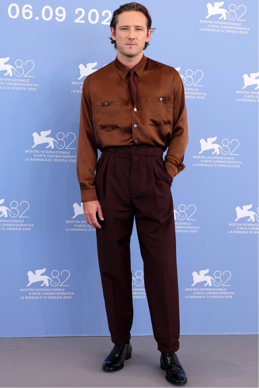 Lewis Pullman in Saint Laurent by Anthony Vaccarello at "The Testament of Ann Lee" photocall in Venice, Italy