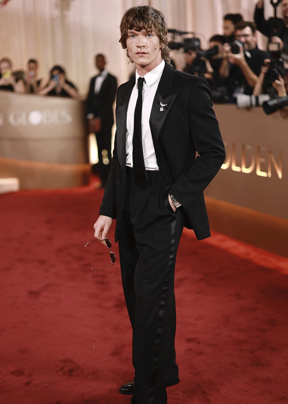 Connor Storrie in Saint Laurent to The 83rd Golden Globes