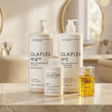 Olaplex hair care products on a bathroom counter, highlighting the acquisition deal.