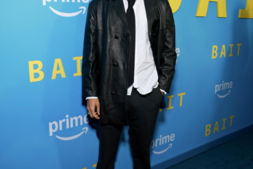 Riz Ahmed in Prada while attending the "Bait" première