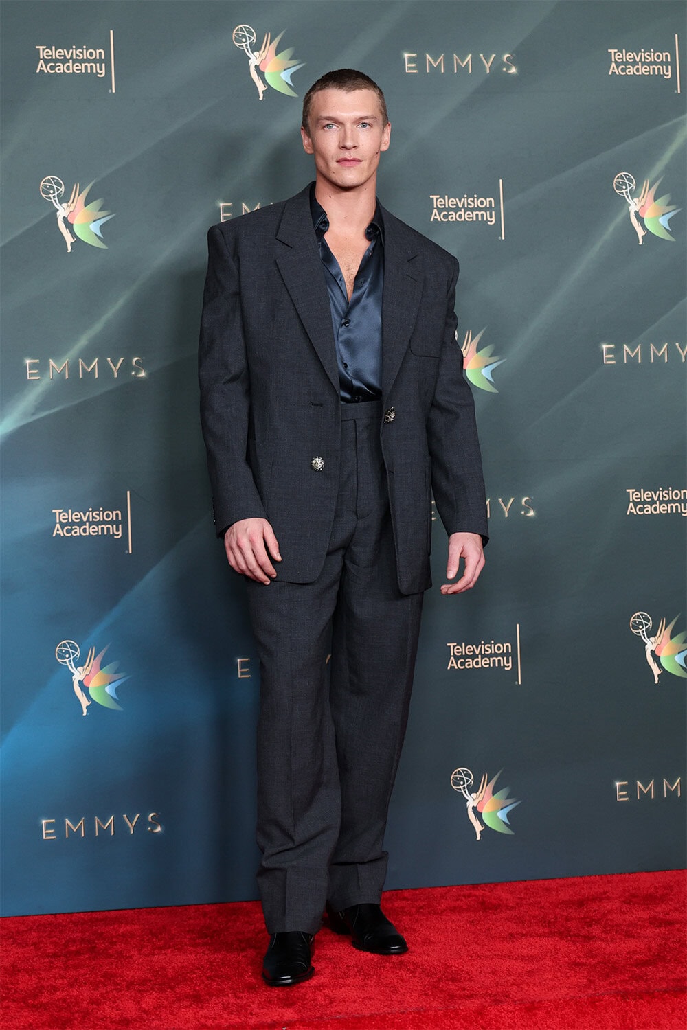 Connor Storrie wears Saint Laurent at 78th Creative Arts Emmy Awards