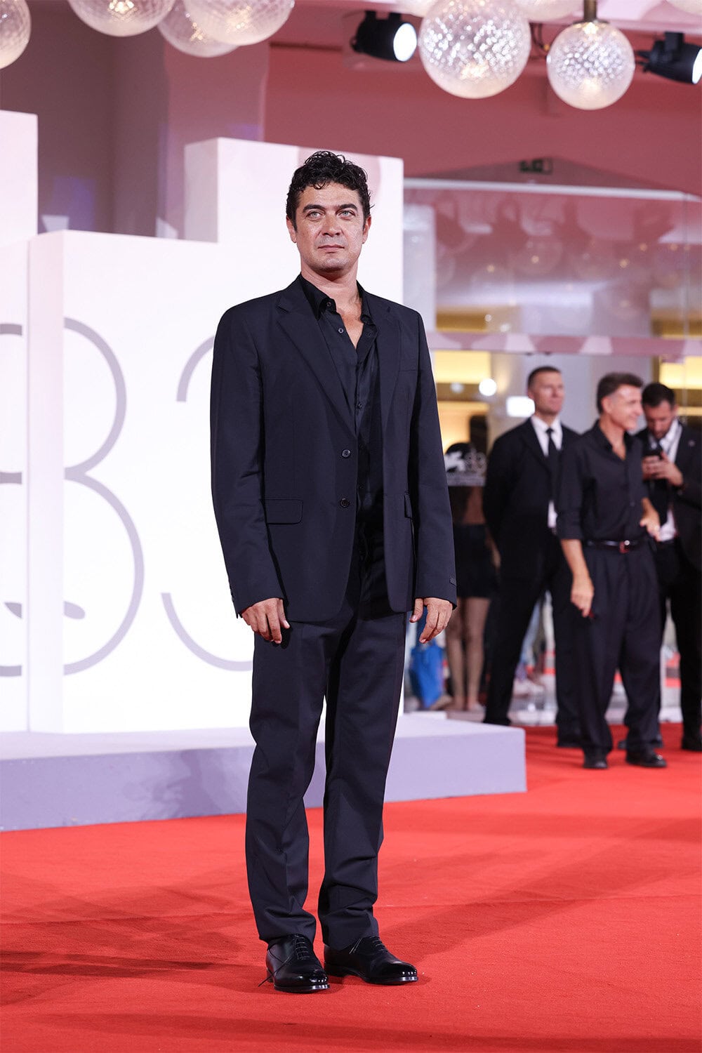 Riccardo Scamarcio wears Prada at The 83rd Venice International Film Festival